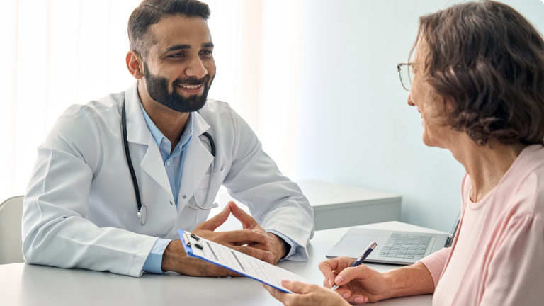 Male Doctor Talking To Patient
