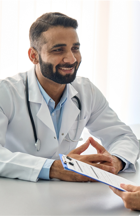 Male Doctor Talking To Patient