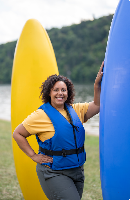 Woman smiling with paddleboards