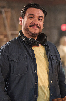 Boom operator and server with juice smiling