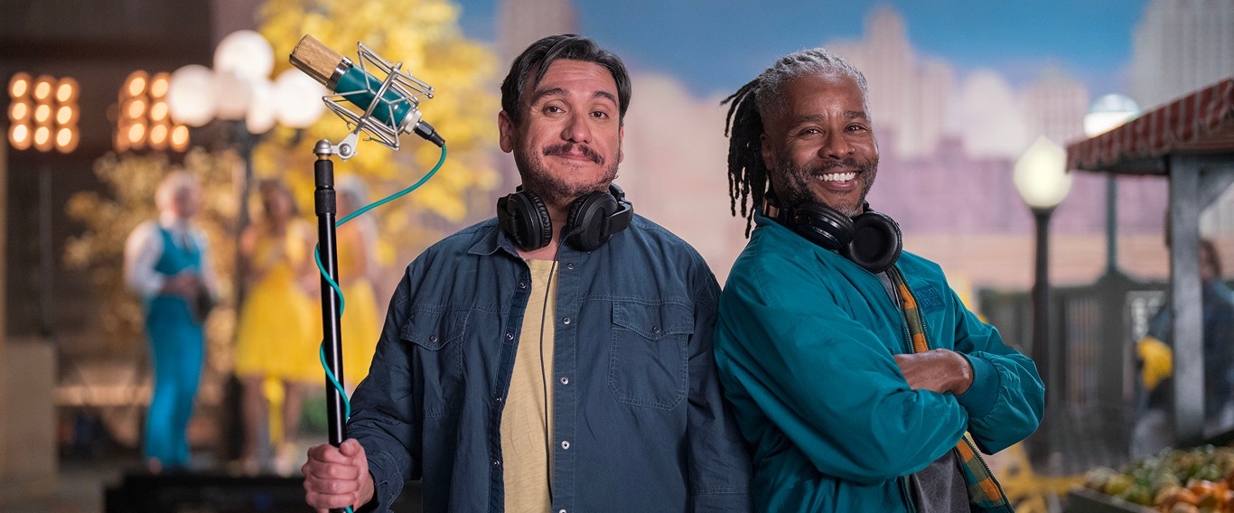 Boom operator and sound technician smiling